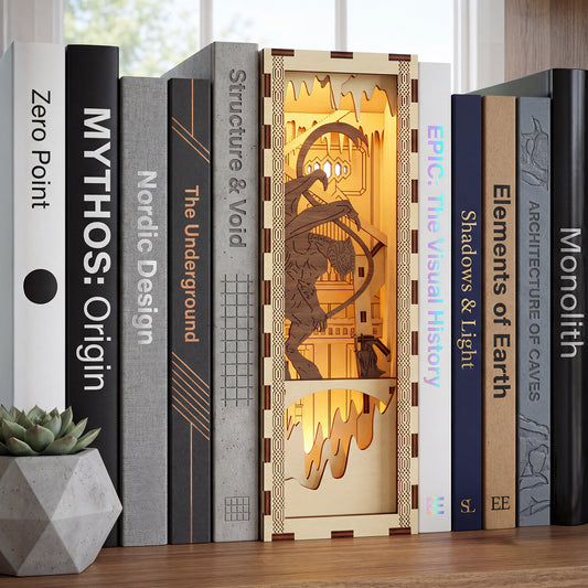 Fantasy-themed Book Nook #2 made of laser cut wood with glowing cave details, displayed next to a geometric concrete planter background.