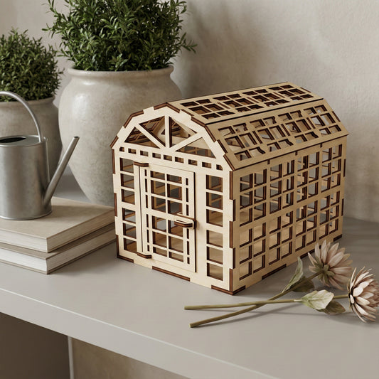 Charming laser cut wooden greenhouse showcasing a detailed arched roof, lattice structure, and small door accent, placed on a wooden surface in a softly lit home setting background.