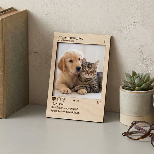 Natural wood laser cut social media style picture frame featuring adorable pet duo photo, custom username and caption, displayed in a warm indoor setting.