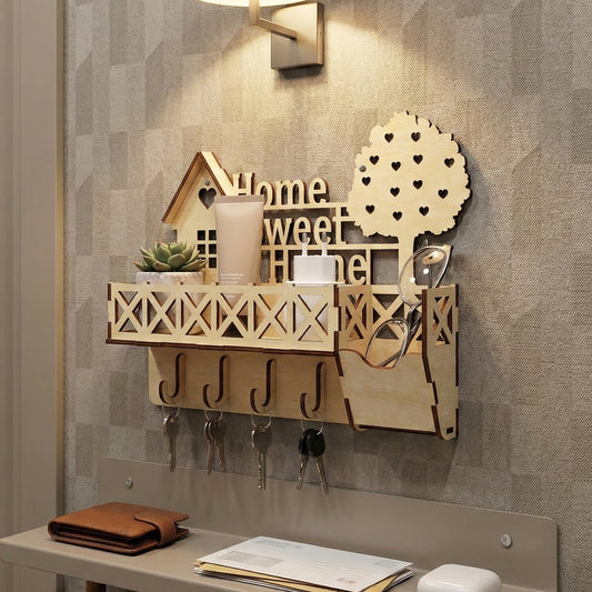 Cozy laser cut wooden keyholder featuring "Home Sweet Home" lettering, a decorative house frame, crisscross railing shelf, key hooks, and a whimsical heart-patterned tree, displayed against a warm textured wall background.