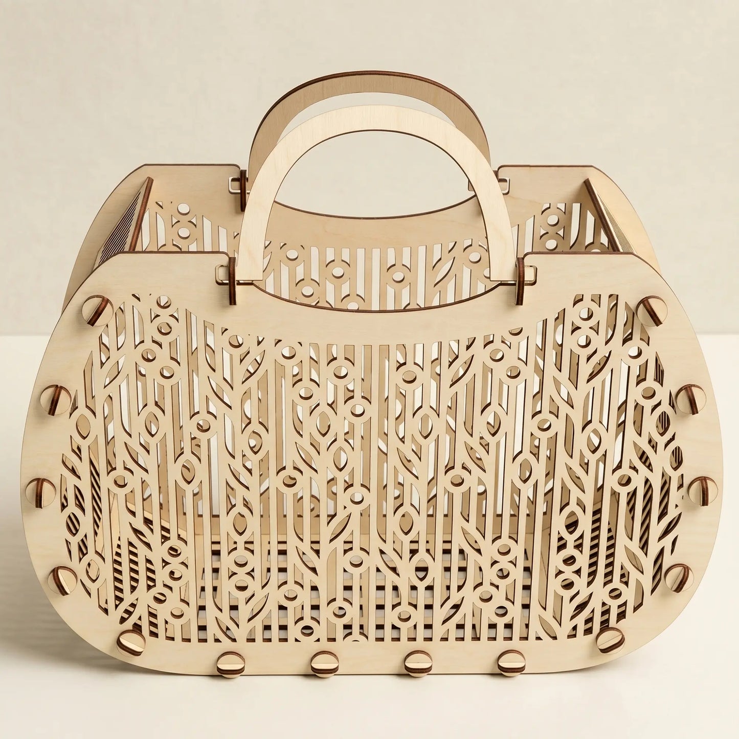 Front view of an empty laser cut plywood tote bag with intricate geometric floral patterns on a white background.