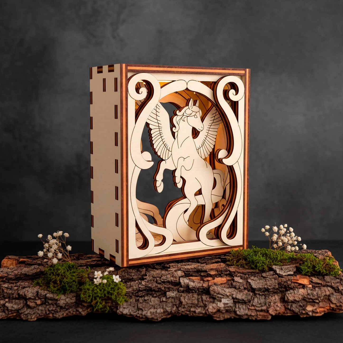 Wooden decorative box with a Pegasus laser cut design on a dark background