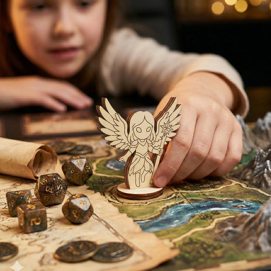 A close-up of a child's hand placing a wooden Celestial Angel figurine on a fantasy board game map. The scene highlights the figurine's use as a tabletop gaming piece, surrounded by glittery d20 dice, metal coins, and 3D mountain terrain.