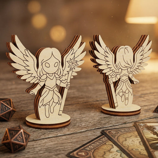Front and back views of a 3D celestial angel figurine handcrafted from layered laser-cut plywood. The chibi-style character features intricately detailed wings and a star-topped staff, mounted on a circular base. Displayed in a tabletop gaming setting on a rustic wooden table with metal polyhedral dice and fantasy cards.