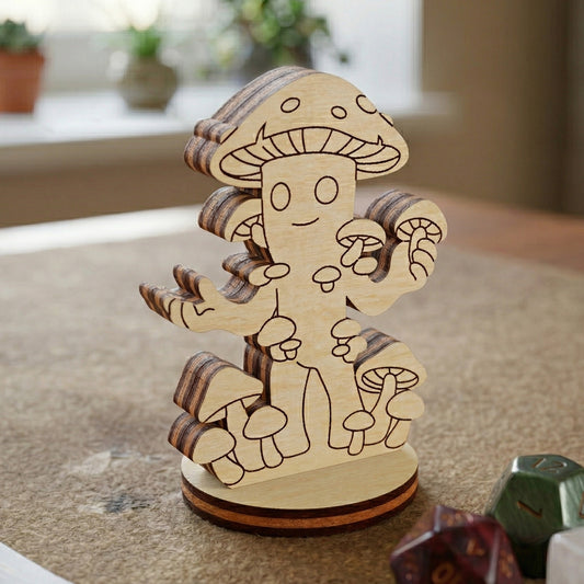 Close-up of a mushroom person figurine crafted from laser cut plywood, featuring intricate engraved patterns and a round base.