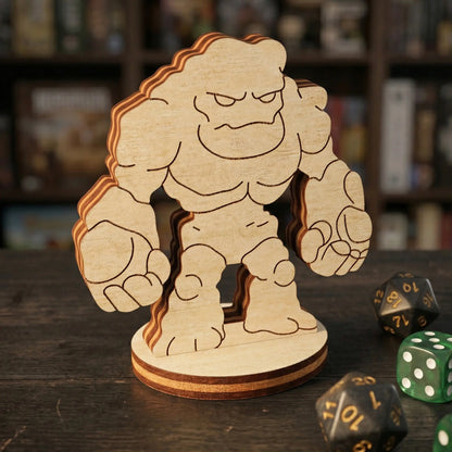 Detailed view of a stone golem tabletop figurine in laser cut plywood, featuring engraved muscles and an angry rocky silhouette.