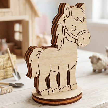 Close-up of an unpainted miniature laser cut plywood horse figurine staged in a rustic toy farm village background.