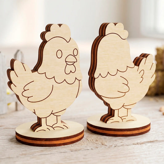 Two laser cut plywood cute hen figures with detailed burnt edges standing on a light rustic wooden surface