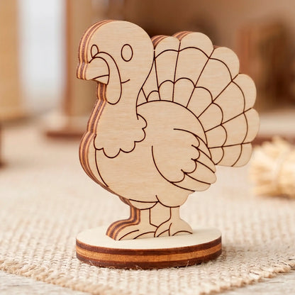 A single laser cut plywood turkey figurine standing on a round base, placed on a beige burlap fabric background.