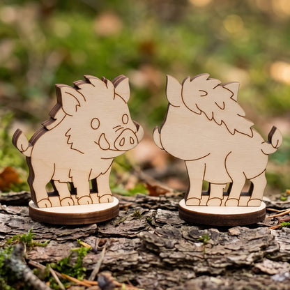 Front and back profile of assembled laser cut plywood wild boar figurine standing on textured tree bark outdoors.