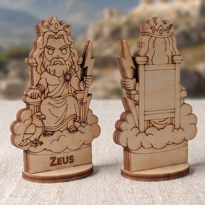 Angled side view of laser cut plywood Zeus figurine showing dark brown burnt edges of wood against ancient Greek ruins.