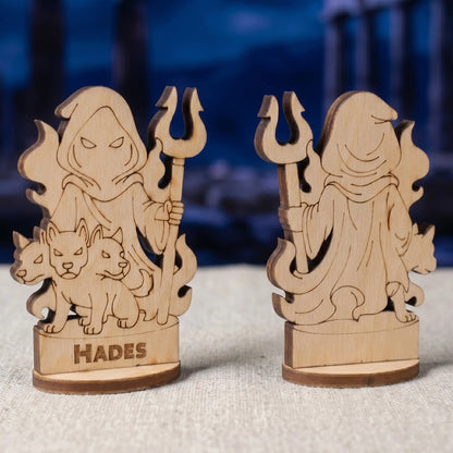 Angled side view of a laser cut plywood Hades figurine showing dark burnt wood edges and detailed character engravings