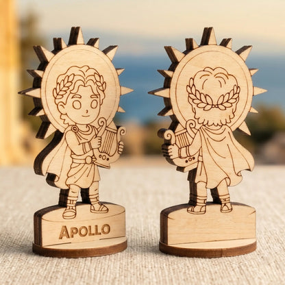 Angled side view of laser cut plywood Apollo figurines showing dark burnt edges and layered texture of the birch wood