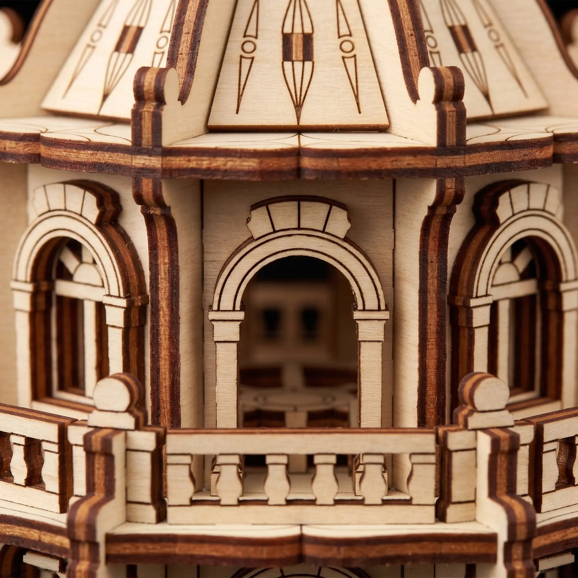 Extreme close-up view showing the arched windows and tiny railings of a laser cut plywood building craft model.
