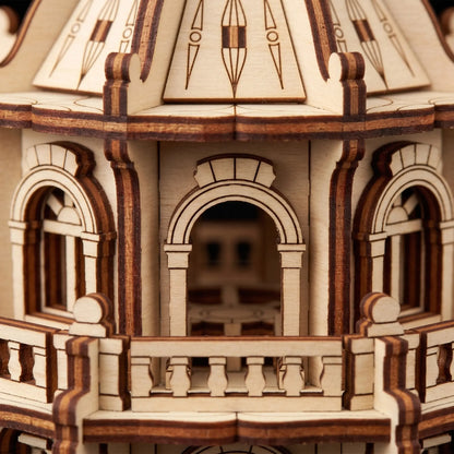 Extreme close-up view showing the arched windows and tiny railings of a laser cut plywood building craft model.