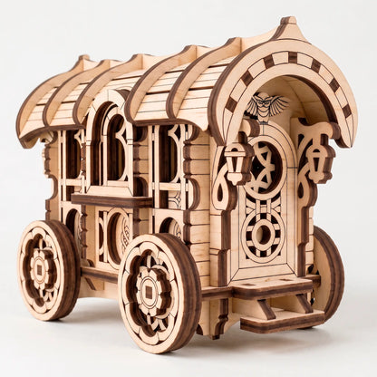 Three-quarter view of the unassembled laser-cut wooden caravan kit, featuring ornate rear door with owl carving and steps