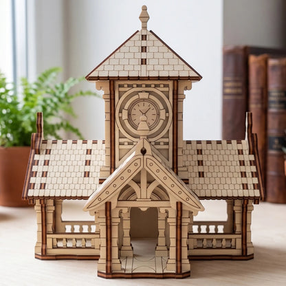 Front view of a miniature laser cut train station with clock tower house model assembled