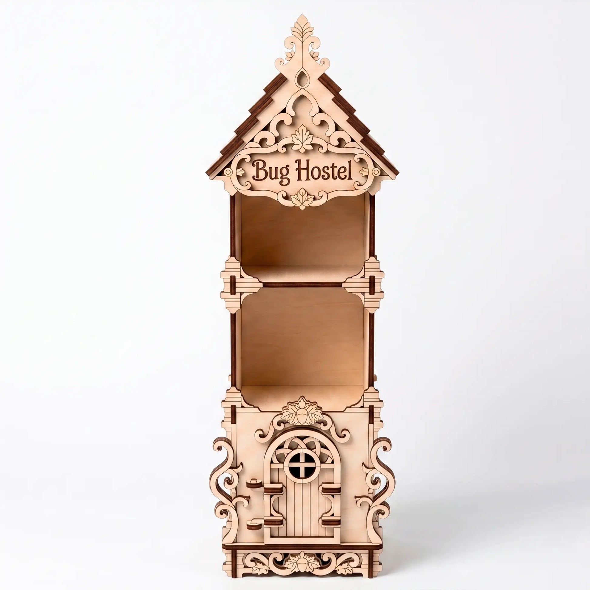 Front-facing studio view of an empty laser-cut birch plywood bug hostel with decorative trim and a carved wooden door.