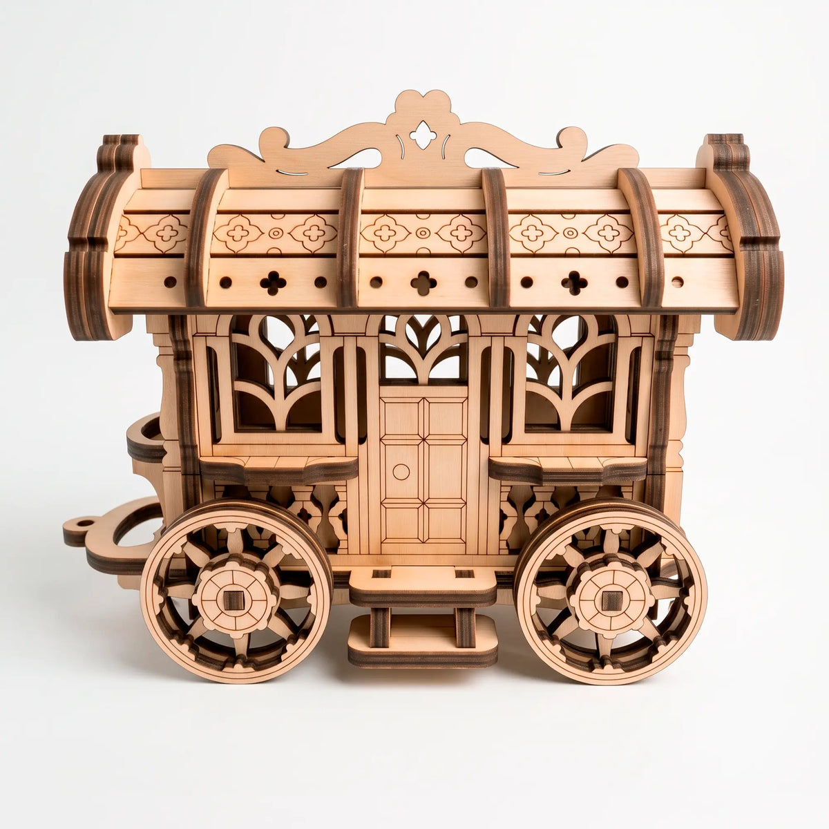 Front angle view of a finished unpainted laser-cut plywood fairy cart model clearly showing its detailed door and windows