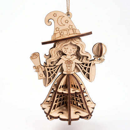 Frontal view of 3D laser cut plywood witch ornament holding potion orb and scroll on plain white surface.