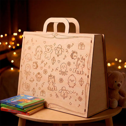 Wooden coloring book with illustrations on a wooden stool against a warm, blurred background.
