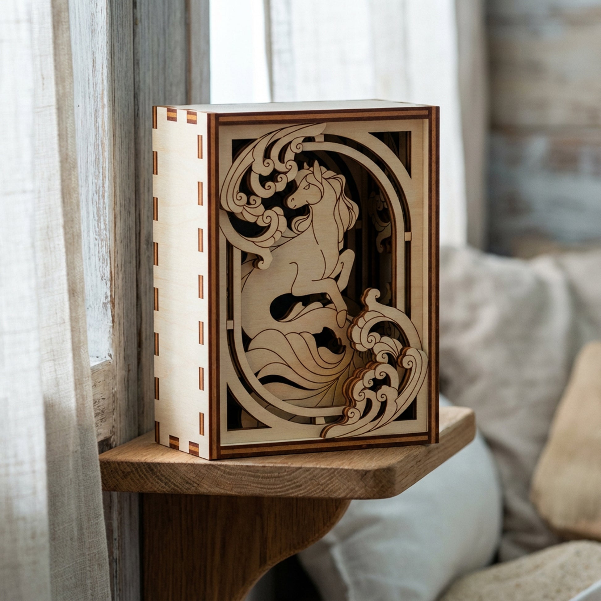 Wooden decorative laser cut box with intricate carvings on a wooden shelf.