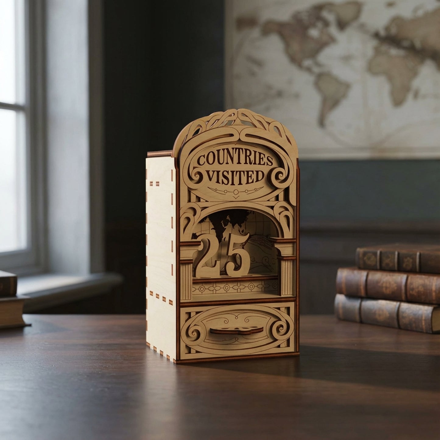 Wooden laser cut travel tracker with 'Countries Visited' display on a desk with books and a world map in the background.