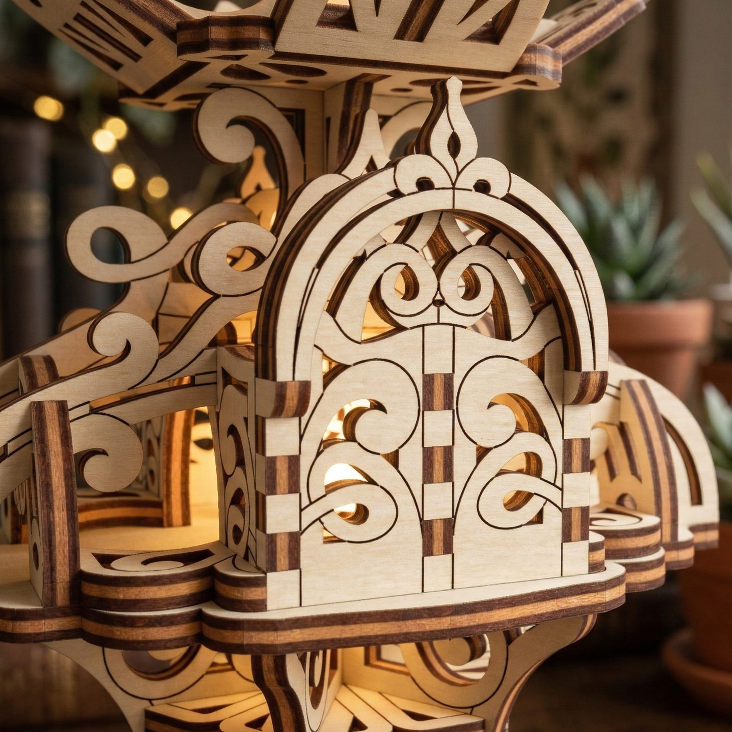Wooden architectural laser cut model with intricate designs on a blurred background