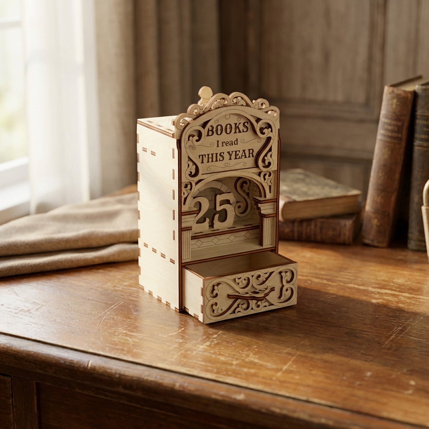 Laser cut book nook digital file showing a wooden bookshelf insert that tracks books read this year, displayed on a vintage desk with classic books.
