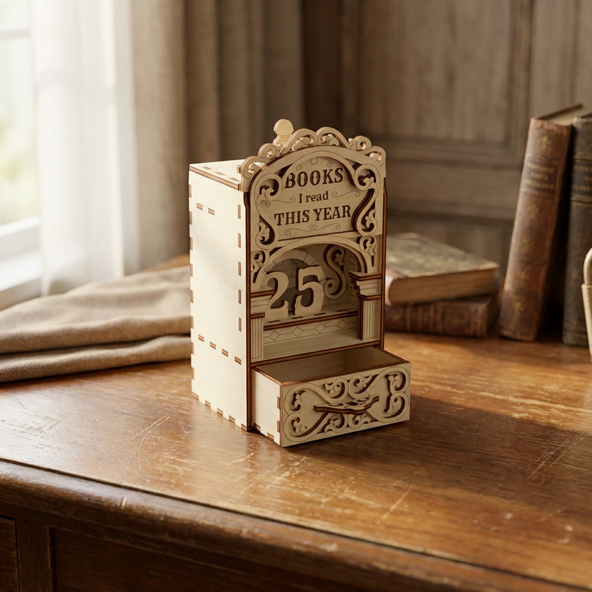 Laser cut book nook digital file showing a wooden bookshelf insert that tracks books read this year, displayed on a vintage desk with classic books.