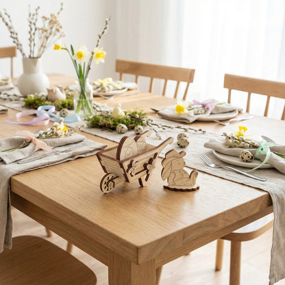 Dining table set with wooden cart and rabbit decorations, surrounded by chairs and floral arrangements.