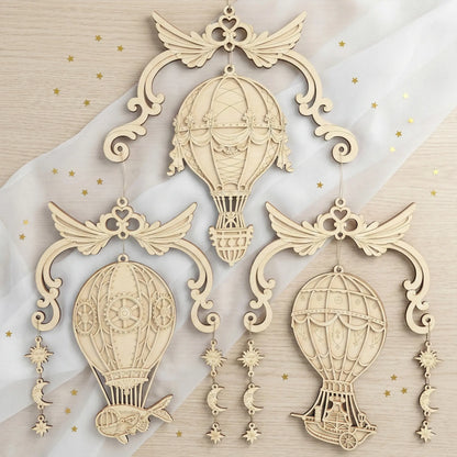 Decorative airship laser cut ornaments with intricate designs on a soft fabric background.