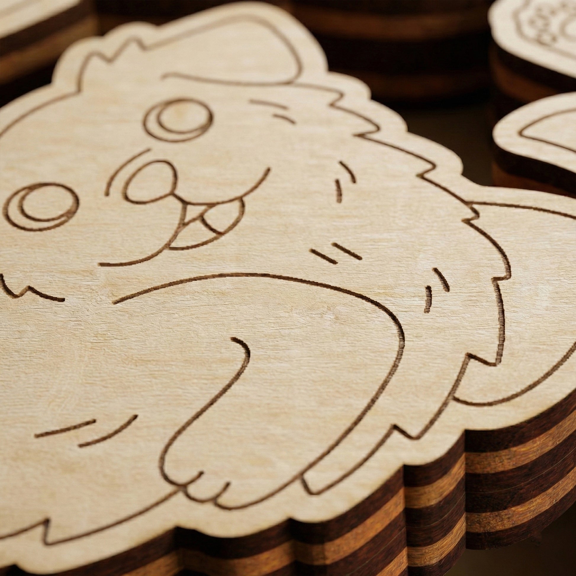 Wooden laser cut cutout with dog designs stacked on a wooden surface