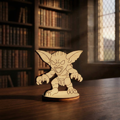 Wooden laser cut creature figurine on a table with bookshelves in the background