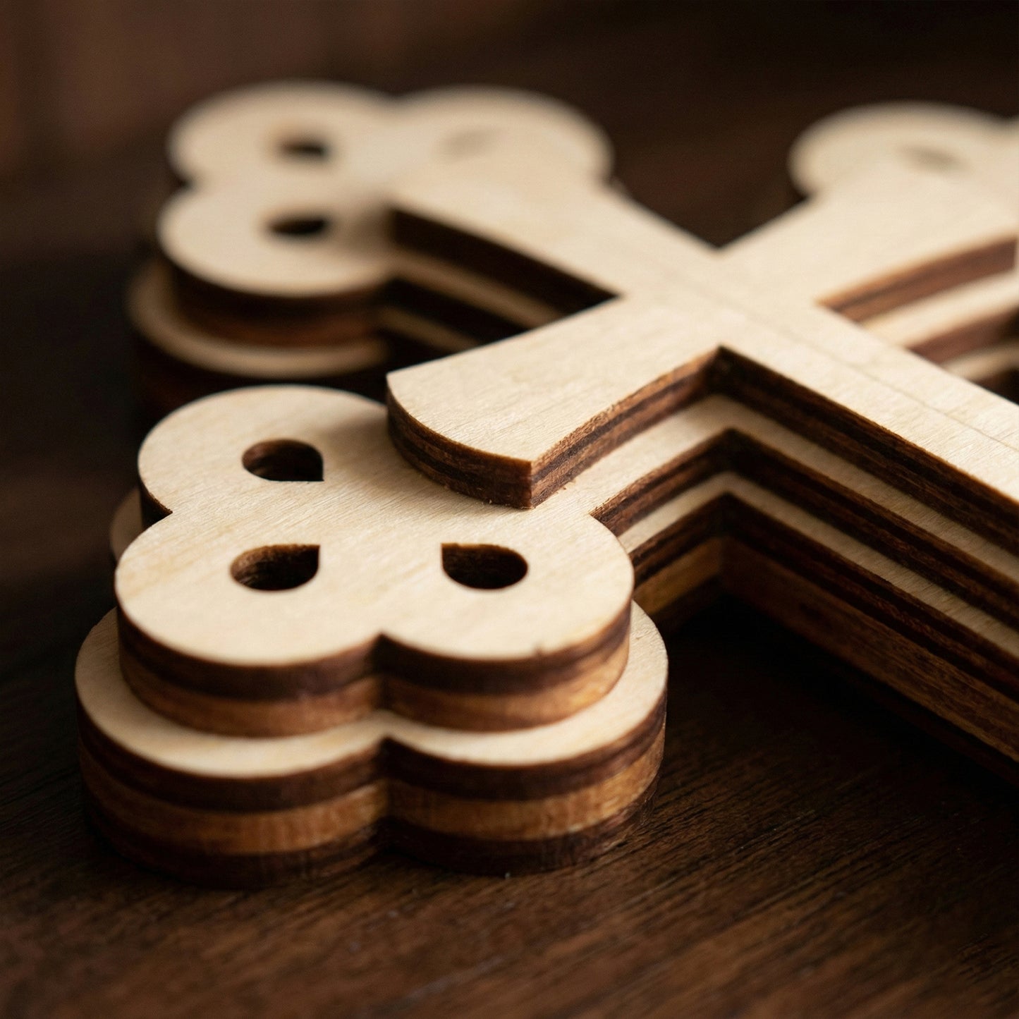 Wooden laser cut puzzle pieces on a wooden surface