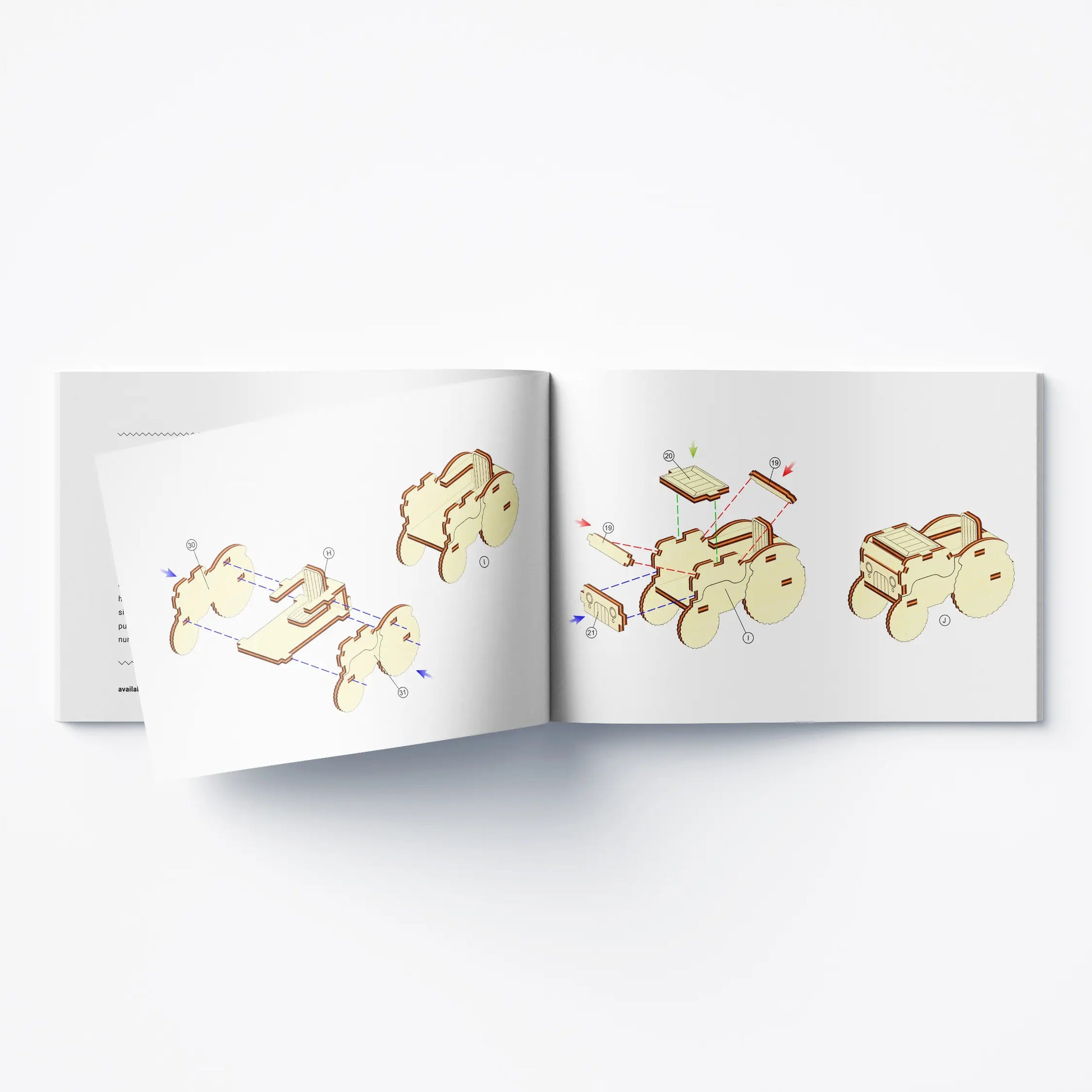 Open printed instruction manual showing 3D step diagrams to build a toy vehicle from laser cut plywood elements.