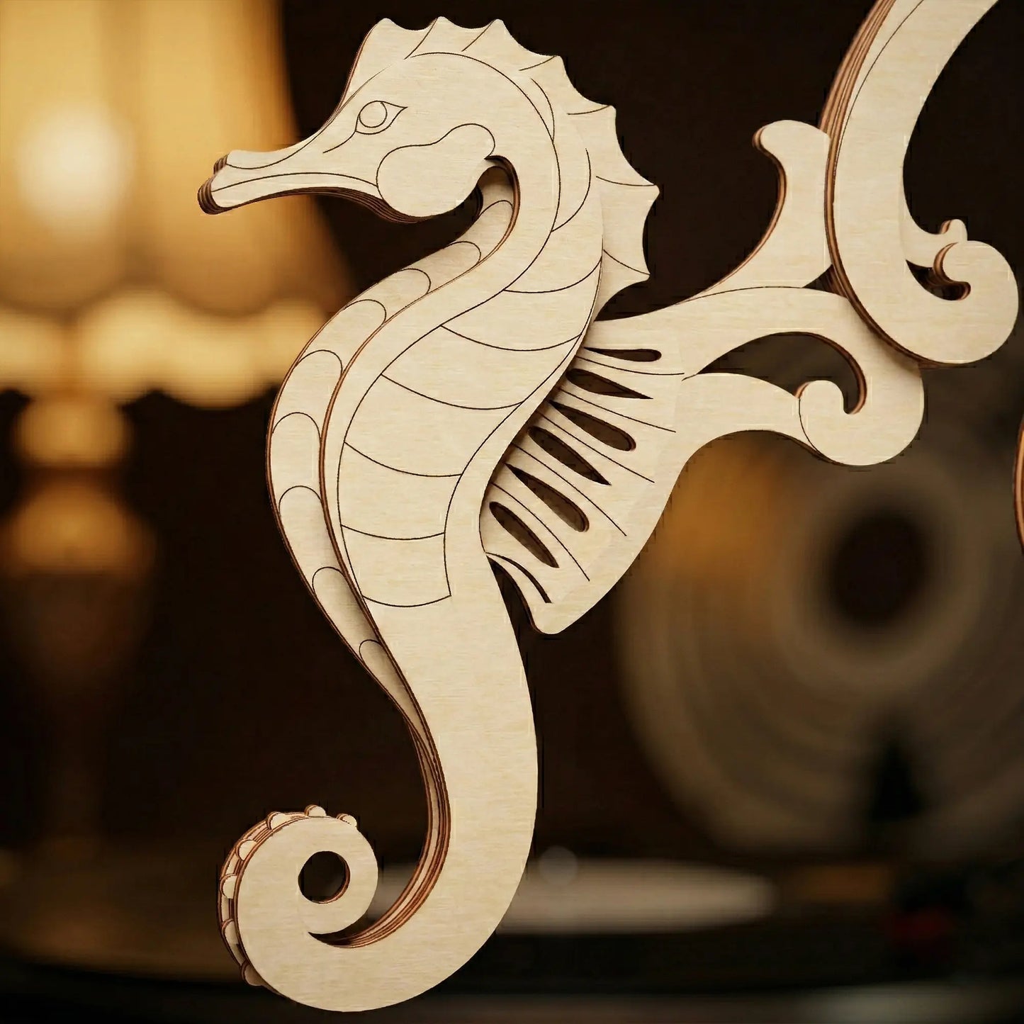Wooden laser cut seahorse decorative item on a blurred background