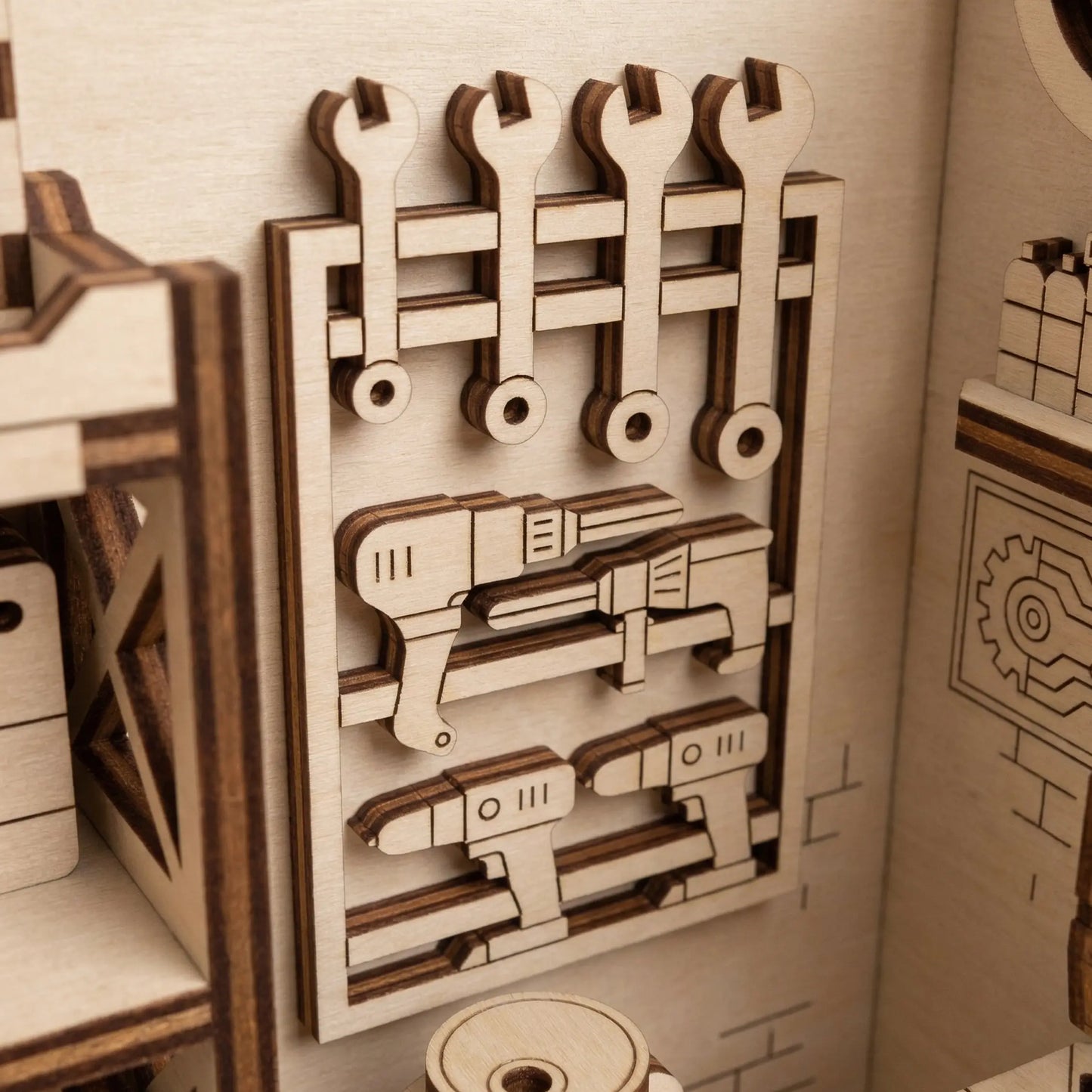 Wooden laser cut tool set with wrenches and pliers on a wall-mounted board in a toy workshop setting.