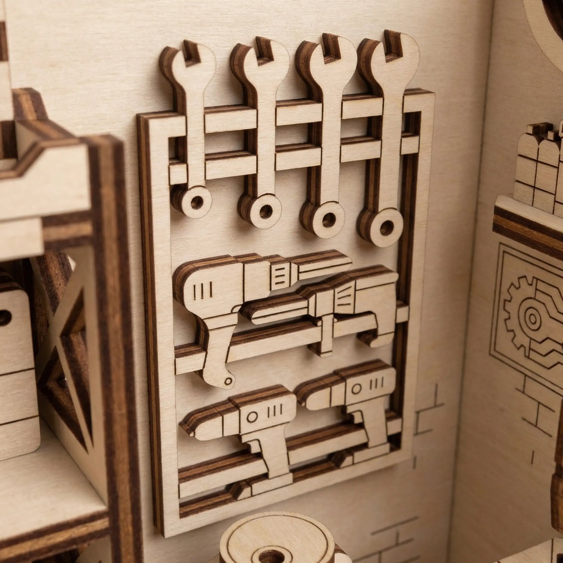 Wooden laser cut tool set with wrenches and pliers on a wall-mounted board in a toy workshop setting.