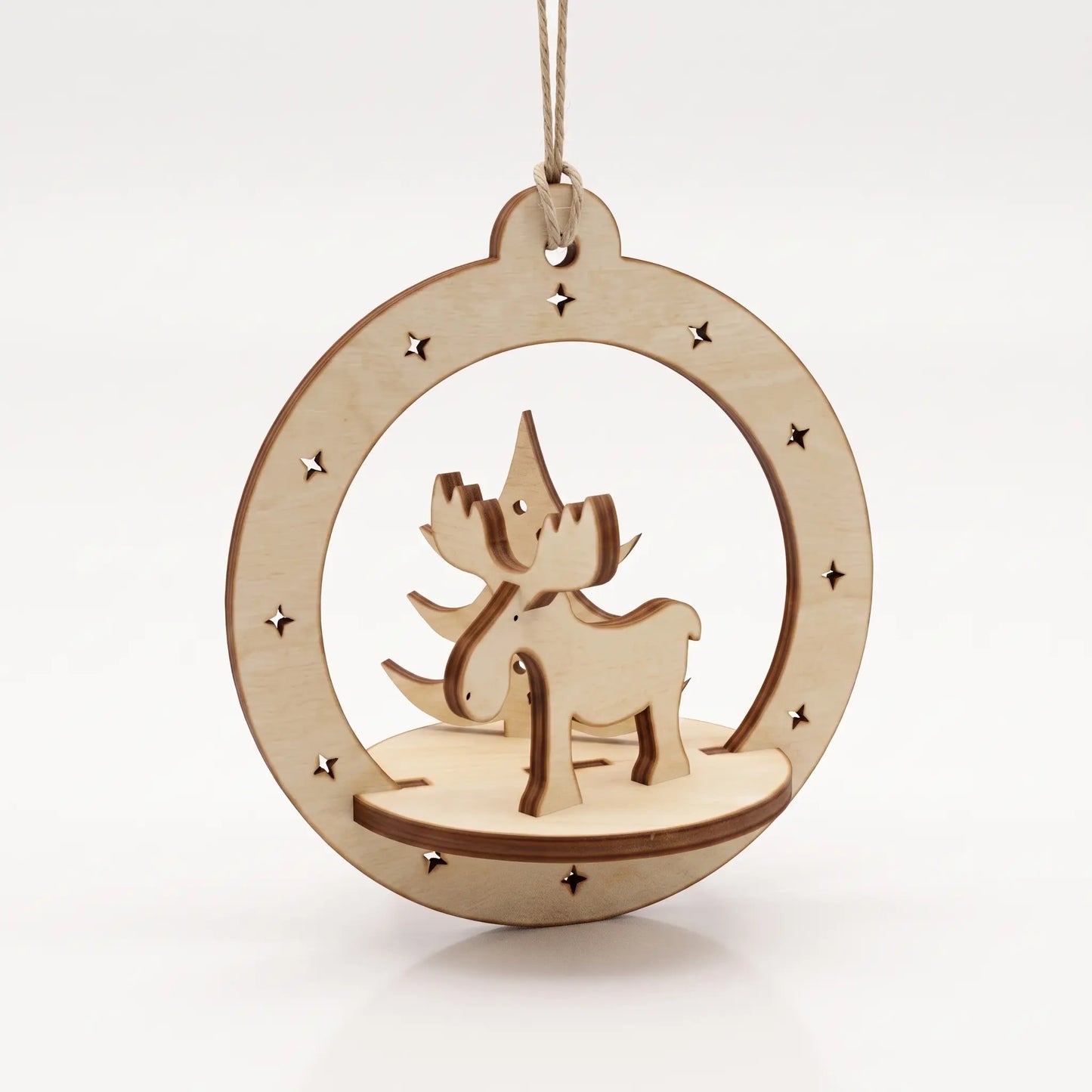 Front view of assembled 3D laser cut plywood circular ornament with slotted deer figure on white textured base