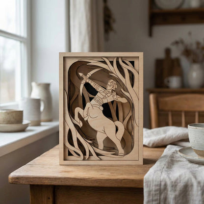 Wooden decorative piece with a laser cut centaur design on a wooden table.