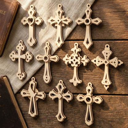 Wooden laser cut cross pendants on a wooden surface with books in the background