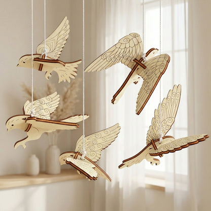 Decorative wooden laser cut  birds hanging against a neutral background