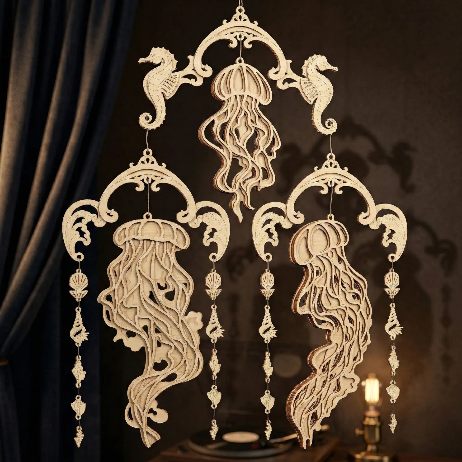 Decorative laser cut wall hanging with jellyfish and seahorse designs on a dark background