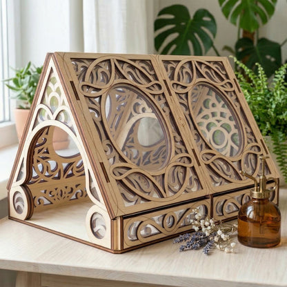 Wooden decorative laser cut box with intricate carvings on a table with plants in the background