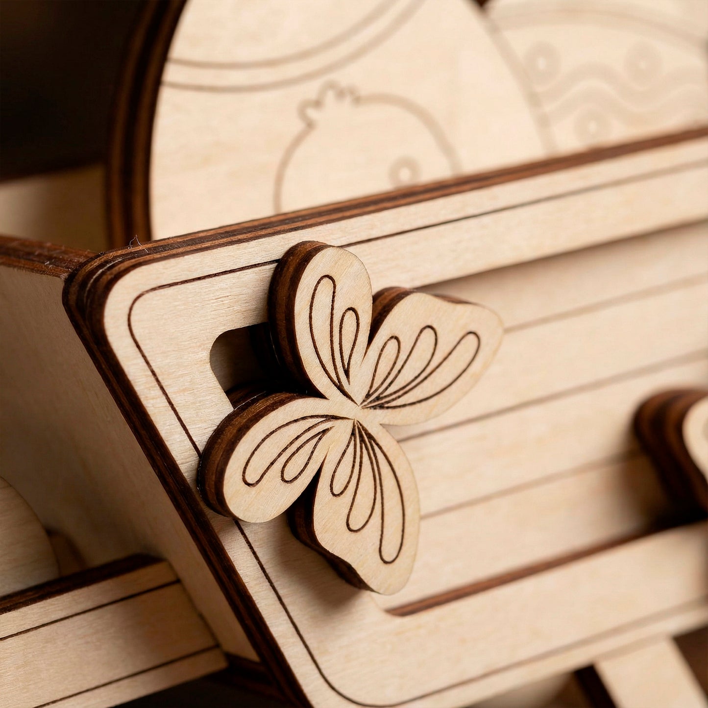 Wooden laser cut butterfly ornament on a wooden surface