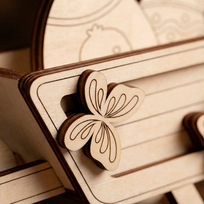 Wooden laser cut butterfly ornament on a wooden surface