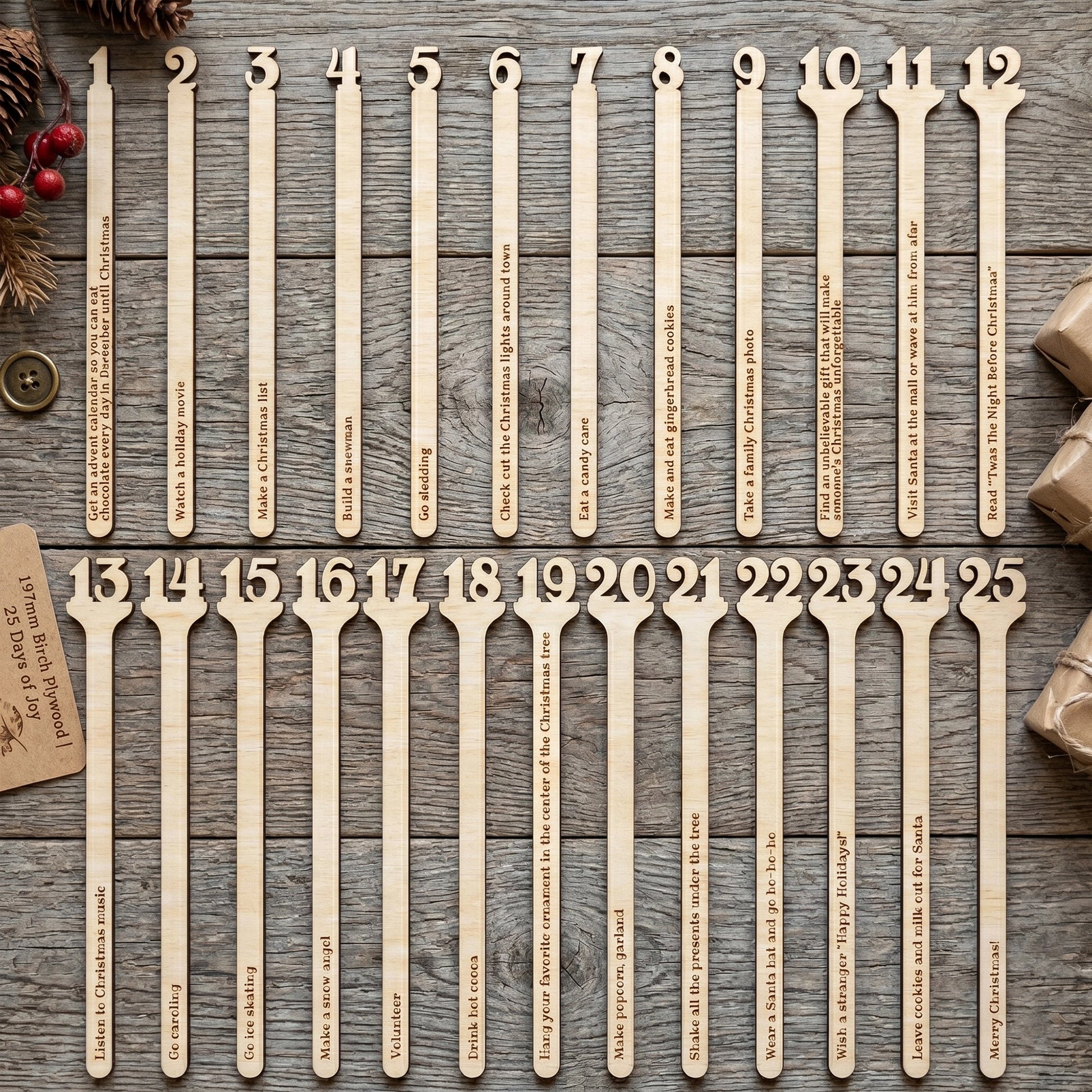 Laser cut plywood Christmas advent calendar sticks in a glass cup on a wooden table, styled with festive pine branches.