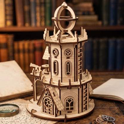 Detailed 3D astronomical tower made from laser cut plywood on a wooden desk. Features a telescope and a top sphere detail.