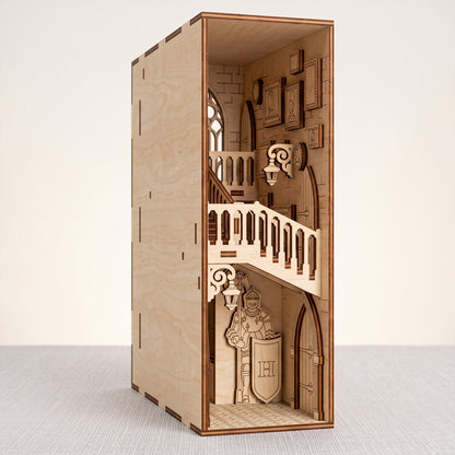 Three-quarter studio view of a laser-cut birch plywood castle book nook with gothic stairs and a knight sculpture